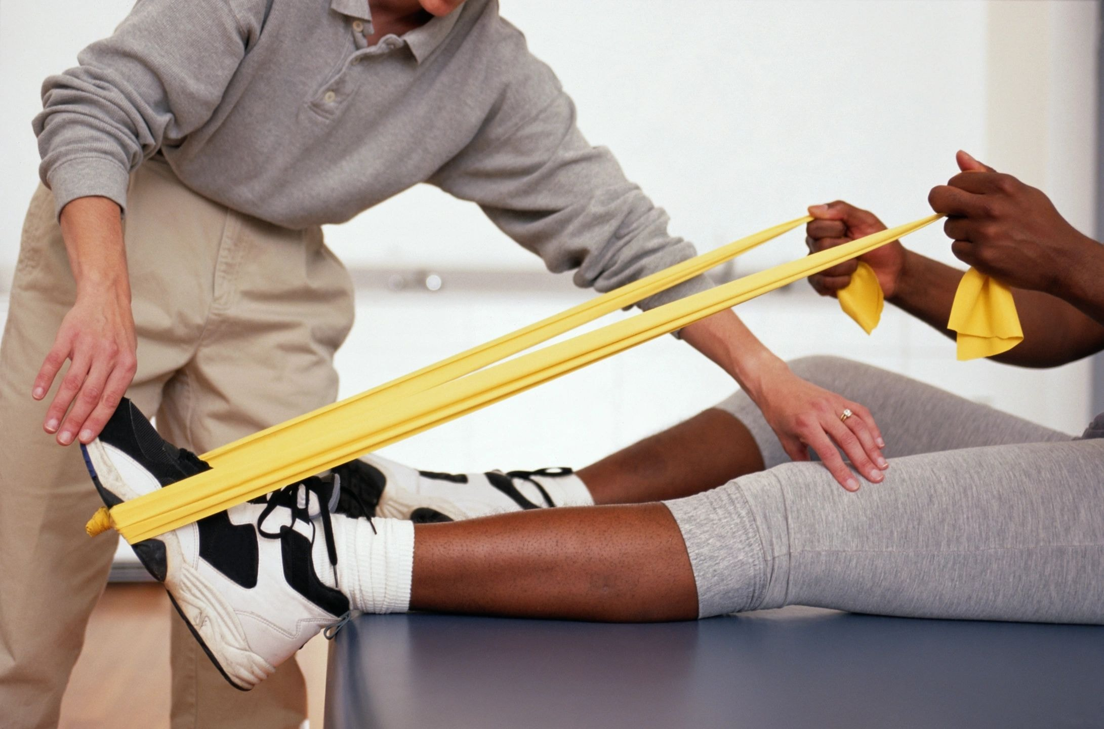Knee taping treatment by a physiotherapist